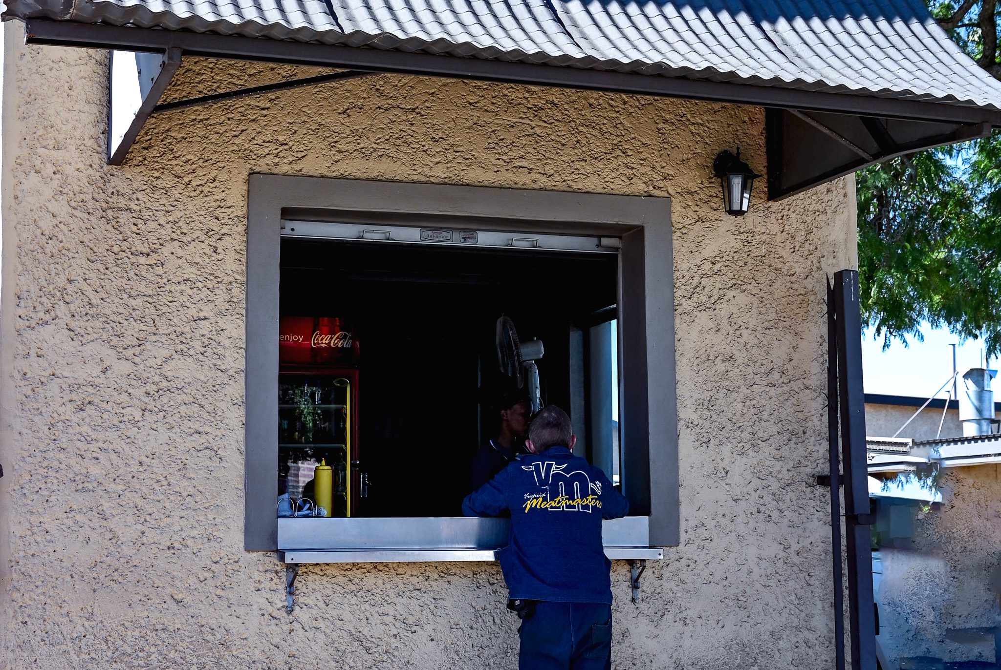 Customer at the Meatmasters take-away hatch in Vryheid